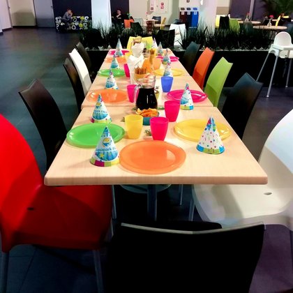 A table at the Restaurant in hall with colorful table setting.